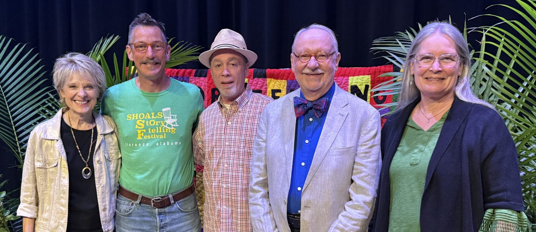 Dolores Hydock, Bil Lepp, Johnny Thomas Fowler, Donald Davis, and Jennifer Armstrong smile on stage after a successful weekend of storytelling in 2026.